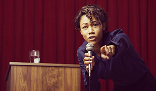 Fiesty african woman motivational speaker pointing at the camera